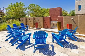 Poolside lounge with fire placeResort-style swimming pool with sun ledge -  ABQ Uptown Apartments